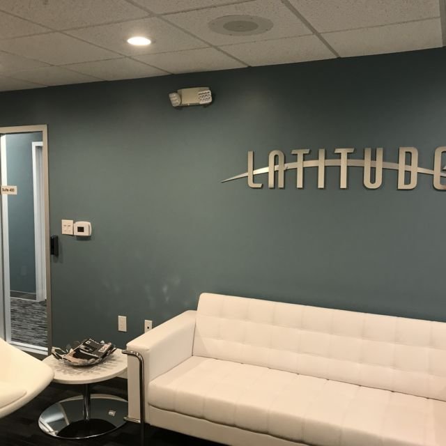 Latitude Lobby Brushed Metal Wall Logo