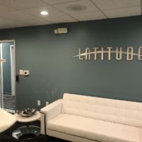 Latitude Lobby Brushed Metal Wall Logo